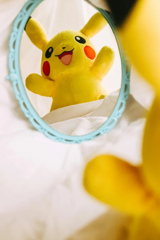 a stuffed animal sitting in front of a mirror, a picture, trending on pexels, pikachu as a human, high angle close up shot, pose(arms up + happy), fantasy themed