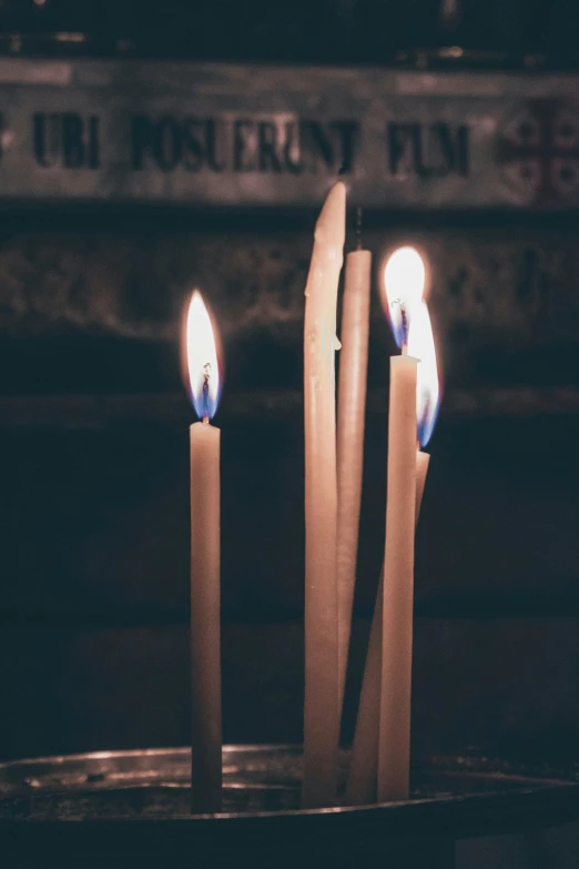 a group of three candles sitting on top of a table, profile image, orthodoxy, multiple stories, vanilla