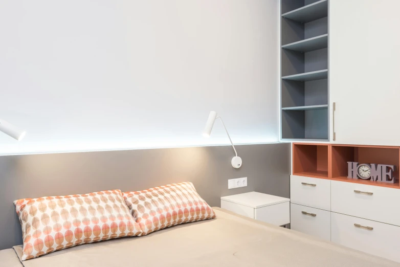 a bed room with a neatly made bed, by Évariste Vital Luminais, light and space, small and cosy student bedroom, led lighting, atmospheric lighting - n 9, cupboards