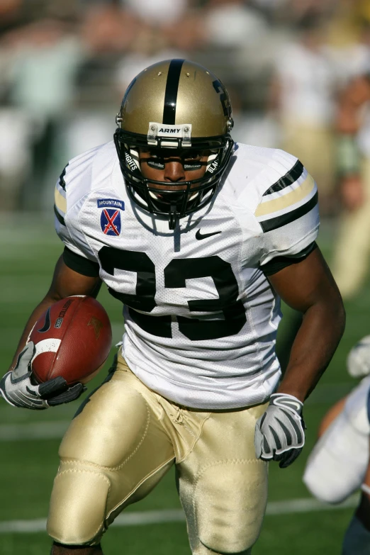 a man running with a football on a field, gold and black color scheme, atiba jefferson, army, in 2 0 0 2