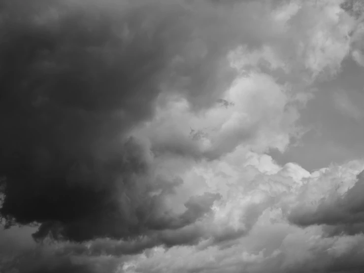 a black and white photo of a cloudy sky, a black and white photo, by Emma Andijewska, pexels, thunderclouds, dream heavenly cloudy sky, thunder clouds modernism, high detail photo