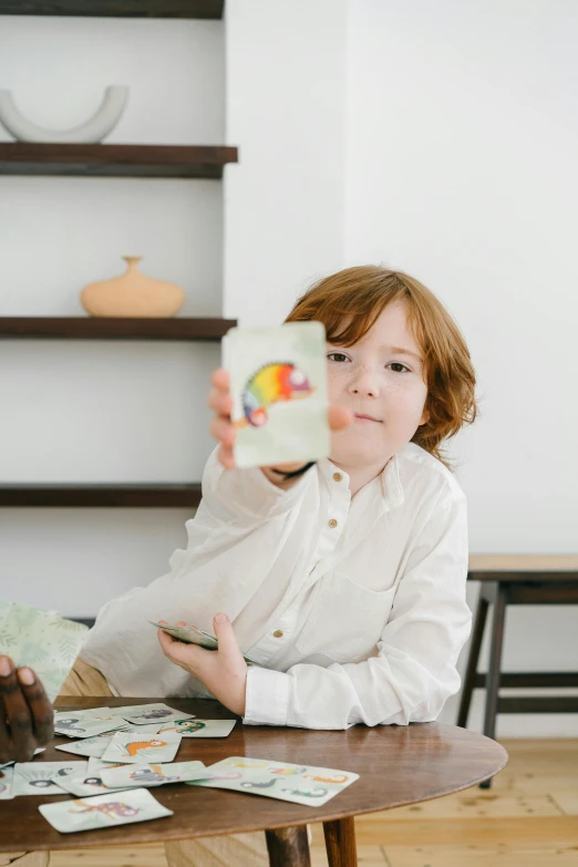 a little boy sitting at a table with a bottle of milk, a child's drawing, pexels contest winner, surrealism, cardistry, brunette boy and redhead boy, trading card, with a white background