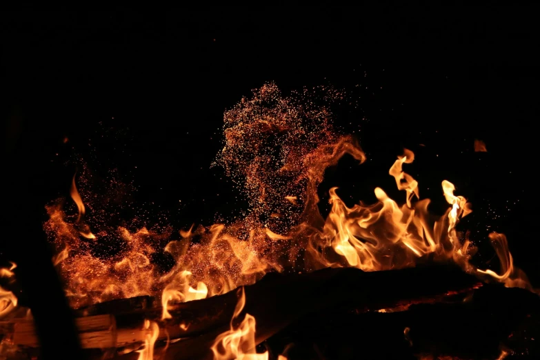 a fire that is burning in the dark, pexels contest winner, figuration libre, a wooden, embers adrift in the air, super high resolution, the fire is made of binary code