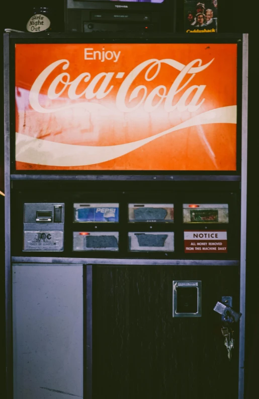 a vending machine with a coca cola sign on it, a polaroid photo, inspired by Elsa Bleda, pexels contest winner, vsco film grain, machines cocktail music, gas station, orange tint