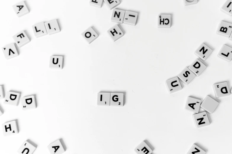 a bunch of letters sitting on top of a white surface, by Emma Andijewska, unsplash, letterism, gaming, tiles, white, background image