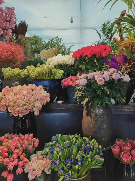 a bunch of flowers sitting on top of a table, musee d'orsay 8 k, colored market stand, no cropping, stunning image