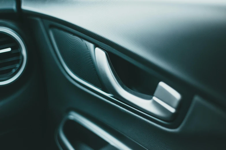 a close up of an air vent in a car, by Carey Morris, pexels contest winner, opening door, synthetic materials, looking left, thumbnail