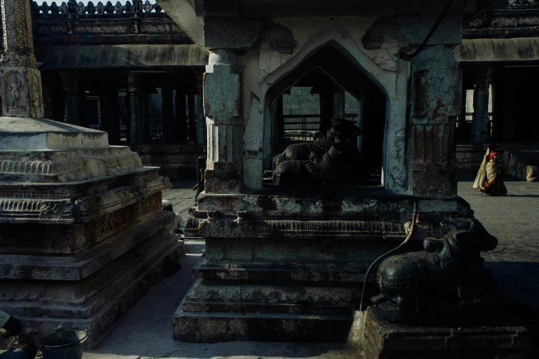 a couple of elephants that are sitting in front of a building, a detailed matte painting, unsplash contest winner, hindu kovil scene, inside the sepulchre, trending on unreal engine 5, sitting on temple stairs