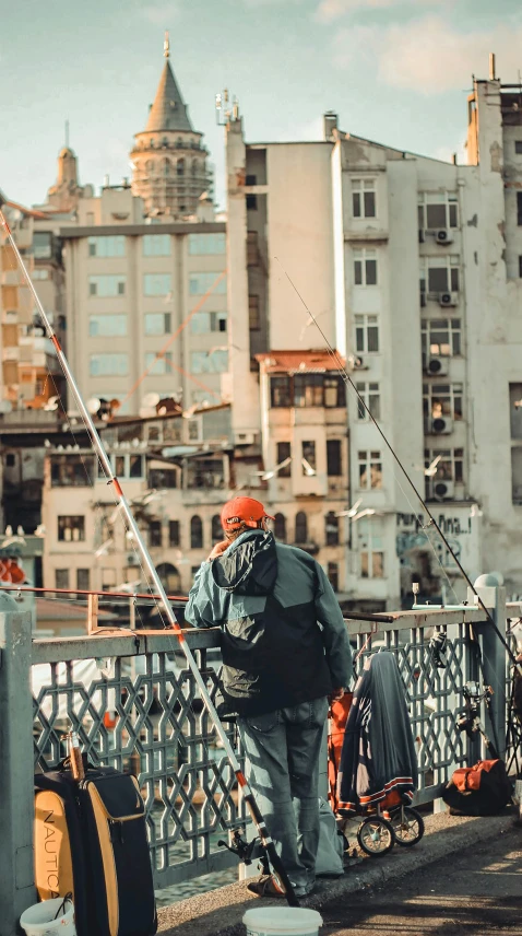 a man standing on a bridge with a fishing rod, pexels contest winner, modernism, busy cityscape, worksafe. instagram photo, buenos aires, behind the scenes