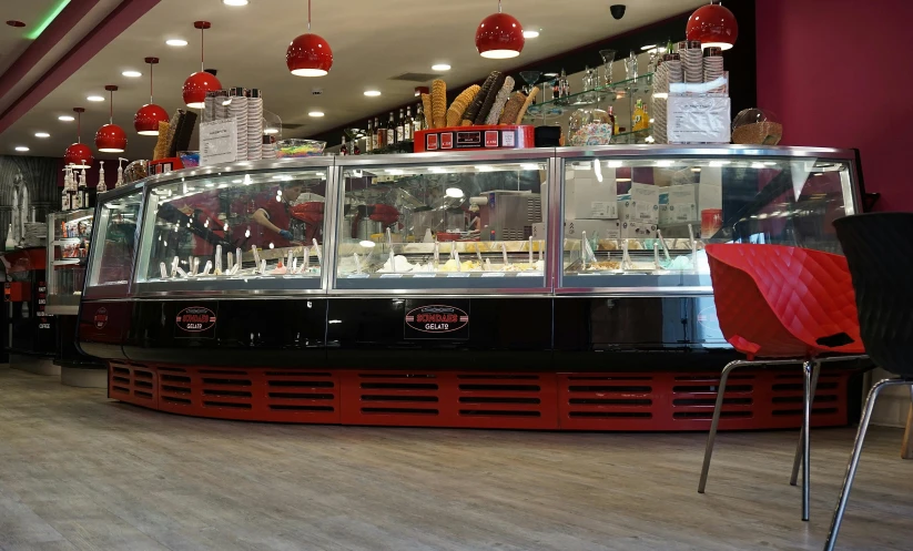 a restaurant filled with lots of different types of food, red and white color theme, ice cream, saturno buttò, profile image