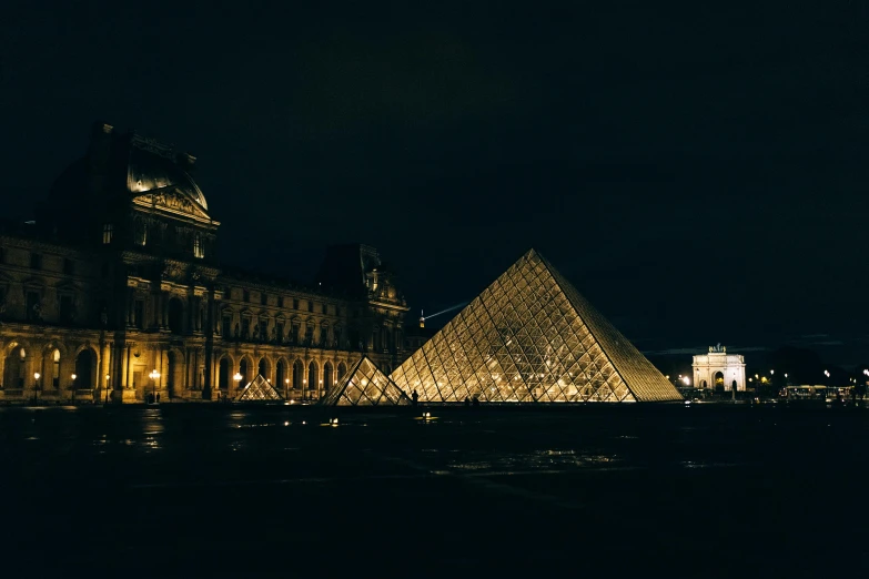 the glass pyramid is lit up at night, a photo, by Julia Pishtar, pexels contest winner, french, classicism, sleepy, gif