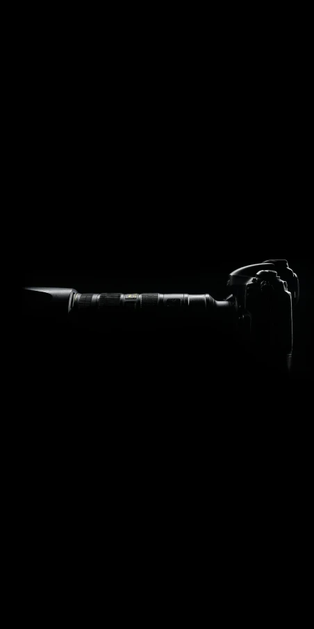 a black and white photo of a knife in the dark, inspired by Robert Mapplethorpe, unsplash, microphone silluette, thors hammer, dark ambient album cover, desolate :: long shot