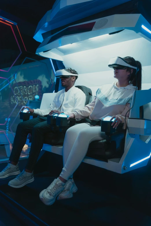 a couple of people that are sitting in a car, a hologram, gaming chair, wearing an astronaut helmet, peak experience ”, orbiting space ships