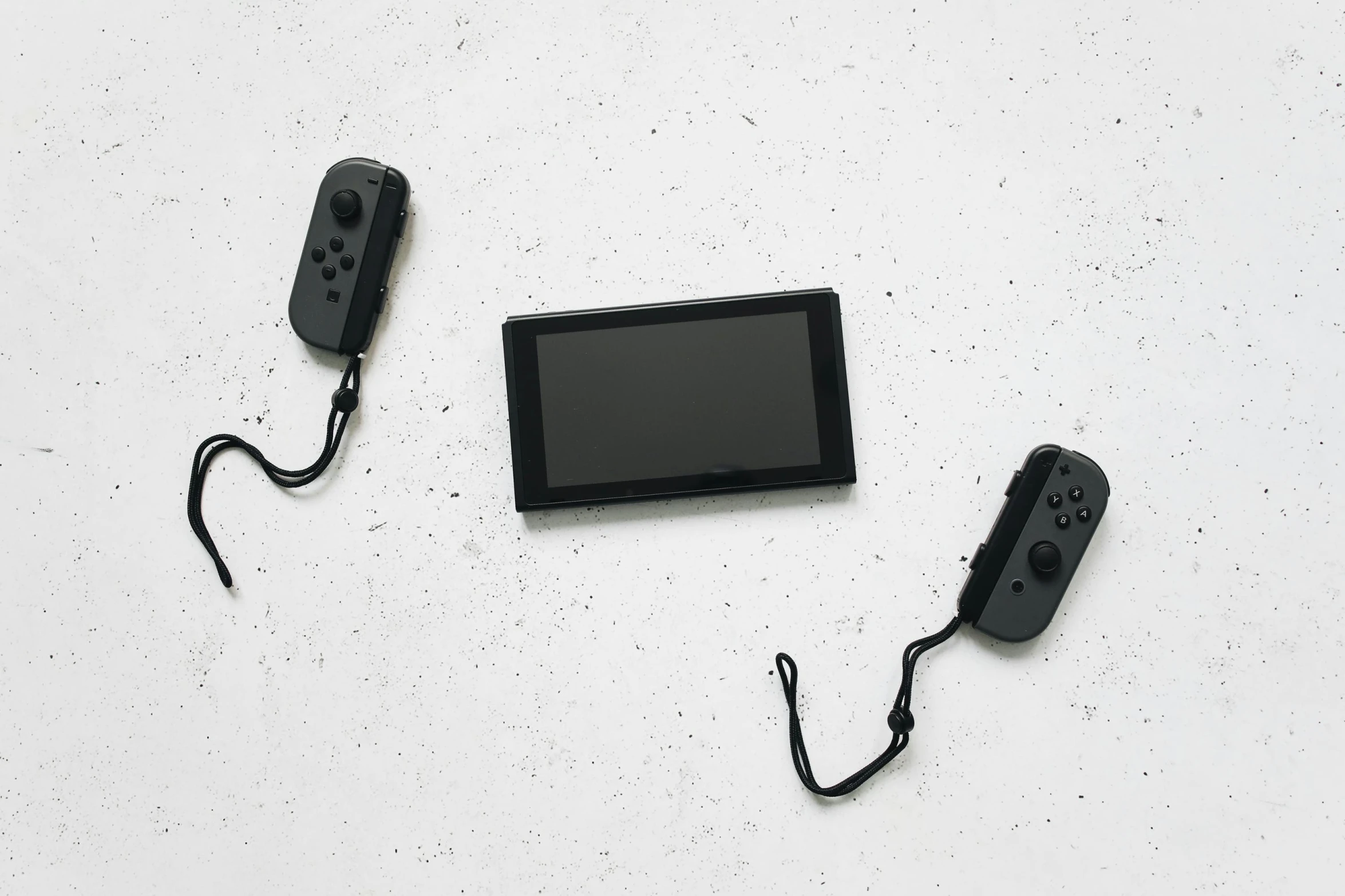 a video game system sitting on top of a table, unsplash, minimalism, switch, black on white background, binding of isaac, twins playing video games