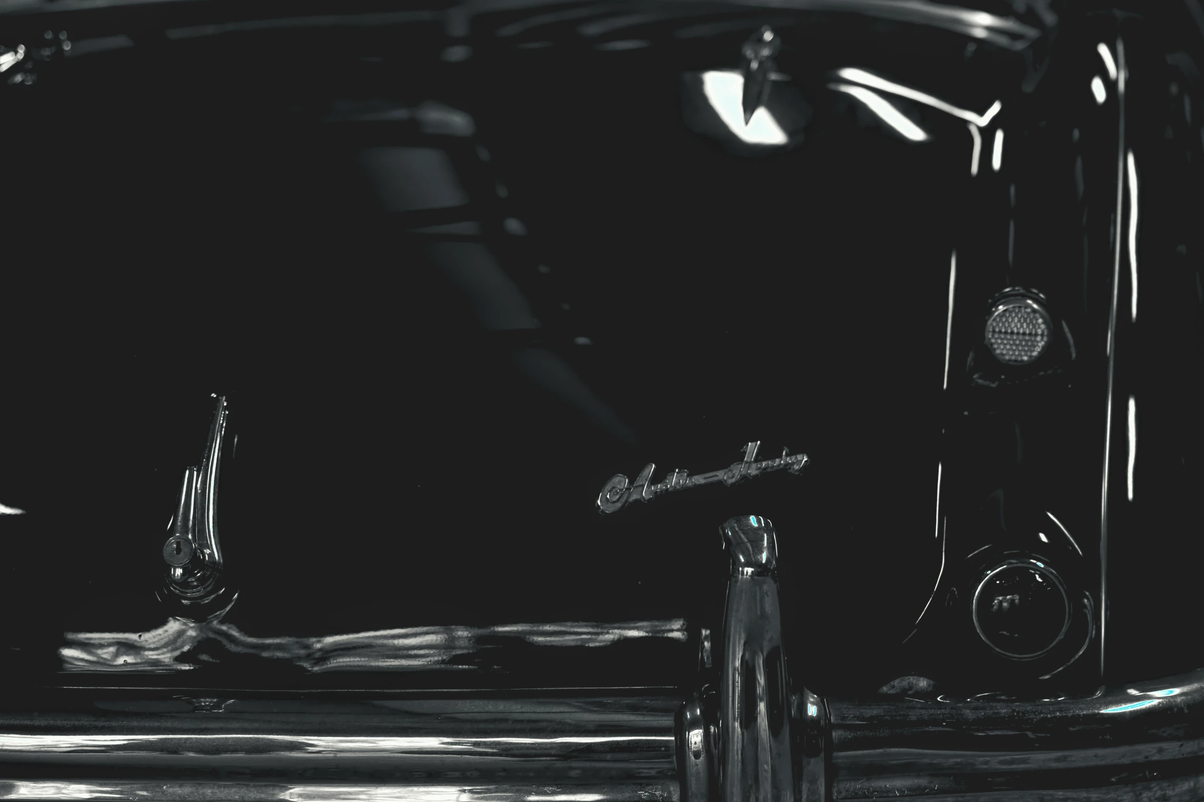 a black and white photo of an old car, an album cover, inspired by Otto Eckmann, unsplash, drum set, glossy digital painting, glossy reflections, the color black