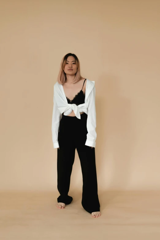 a woman in a white shirt and black pants, trending on unsplash, asian female, cut out, asher duran, dressed with long fluent clothes