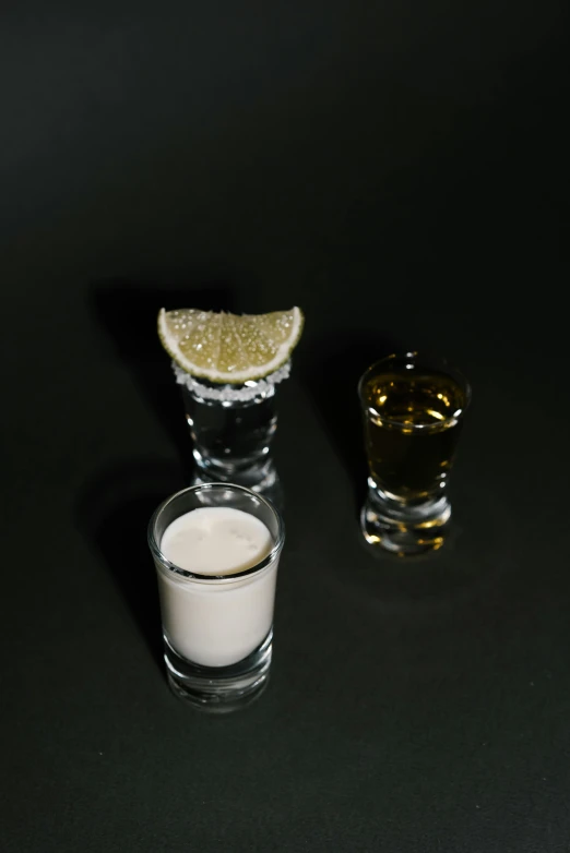 a couple of shot glasses sitting on top of a table