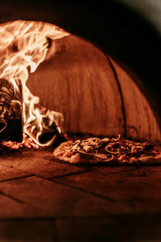 a pizza oven with fire coming out of it, a portrait, pexels contest winner, brown, thumbnail, background image, multiple stories