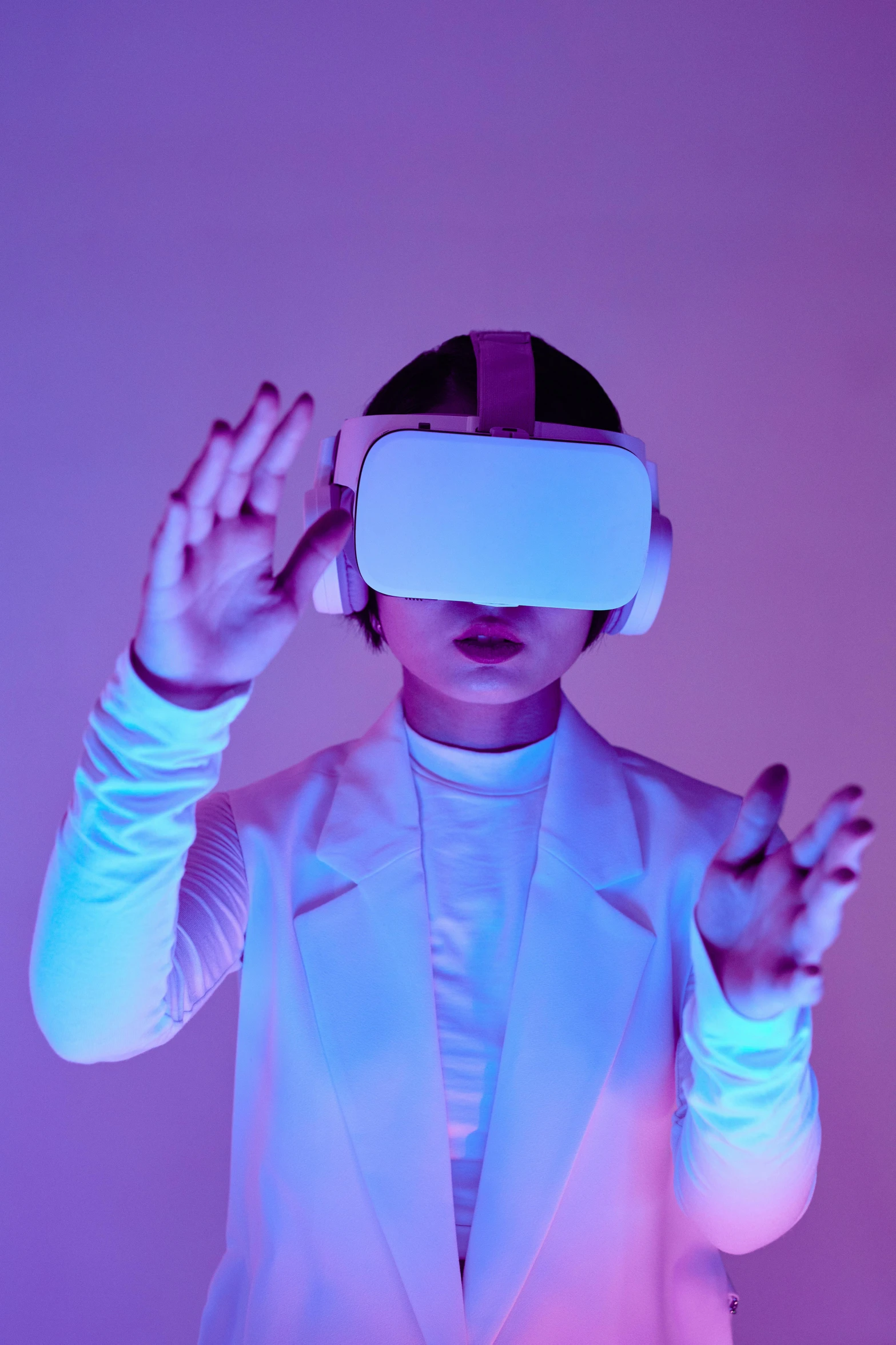 a woman wearing a virtual reality headset, inspired by David LaChapelle, trending on pexels, purple ambient light, wearing white suit and glasses, techno-punk, insightful