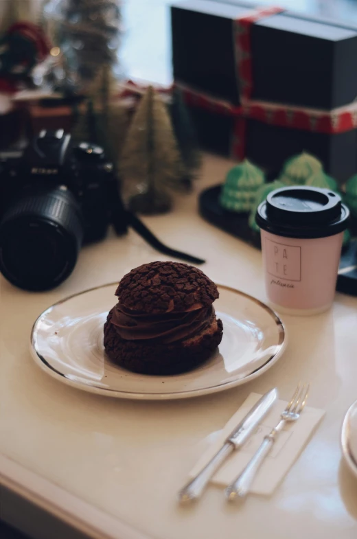 a plate of cookies and a cup of coffee on a table, by Adam Saks, unsplash, photorealism, low quality instant camera photo, holiday, fuji choco, cupcake