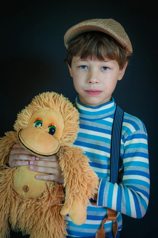 a young boy holding a stuffed animal in his hands, inspired by Emil Orlik, pexels, surrealism, caracter with brown hat, monkey, frown fashion model, slide show