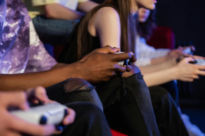 a group of people playing a video game, trending on pexels, realism, bottom angle, diverse, namco, colour corrected