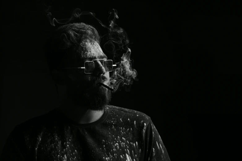 a black and white photo of a man with smoke coming out of his mouth, a black and white photo, pexels contest winner, process art, man with glasses, personification of marijuana, discord profile picture, messy