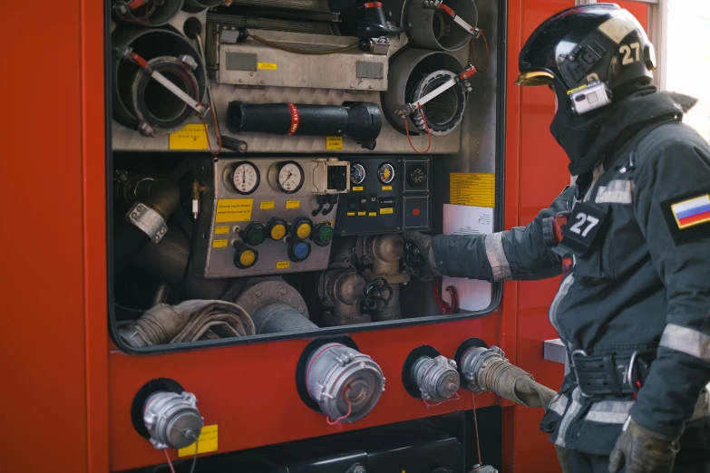 a fireman standing in front of a fire truck, by Adam Marczyński, pexels contest winner, hyperrealism, gas mask, videogame still, rectangle, inside