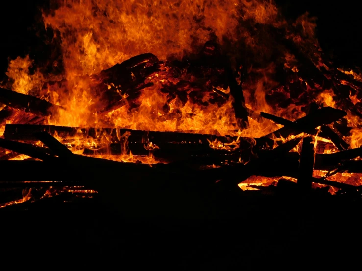 a fire that is burning in the dark, pexels, renaissance, burnt huts, avatar image, full frame image, rioting