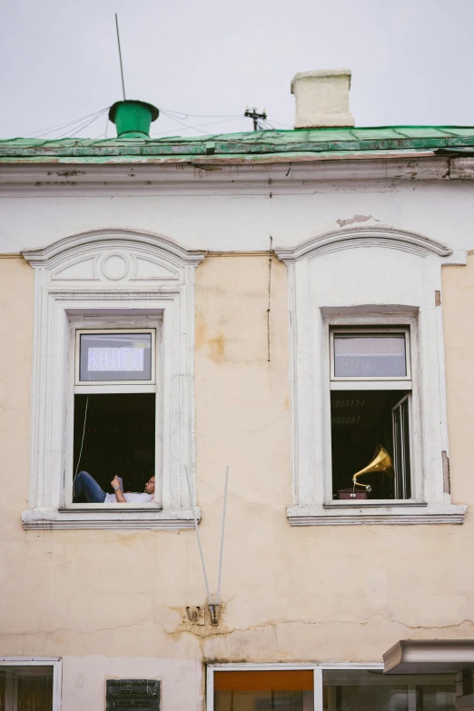 a couple of people that are looking out of a window, by Attila Meszlenyi, happening, brass instruments, in russia, low fi, quaint