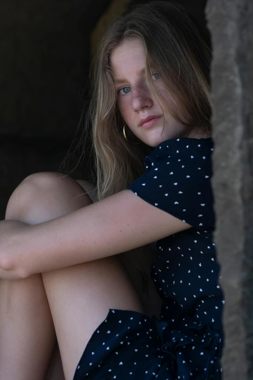 a woman sitting on the ground with her legs crossed, unsplash, renaissance, portrait of teenage girl, polka dot, lachlan bailey, 🤤 girl portrait