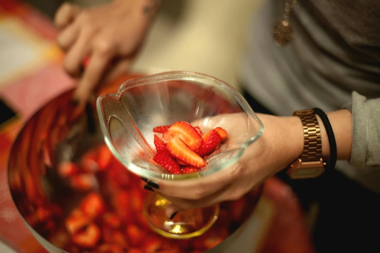 a close up of a person holding a bowl of strawberries, bartending, chopping hands, 🦩🪐🐞👩🏻🦳, infused