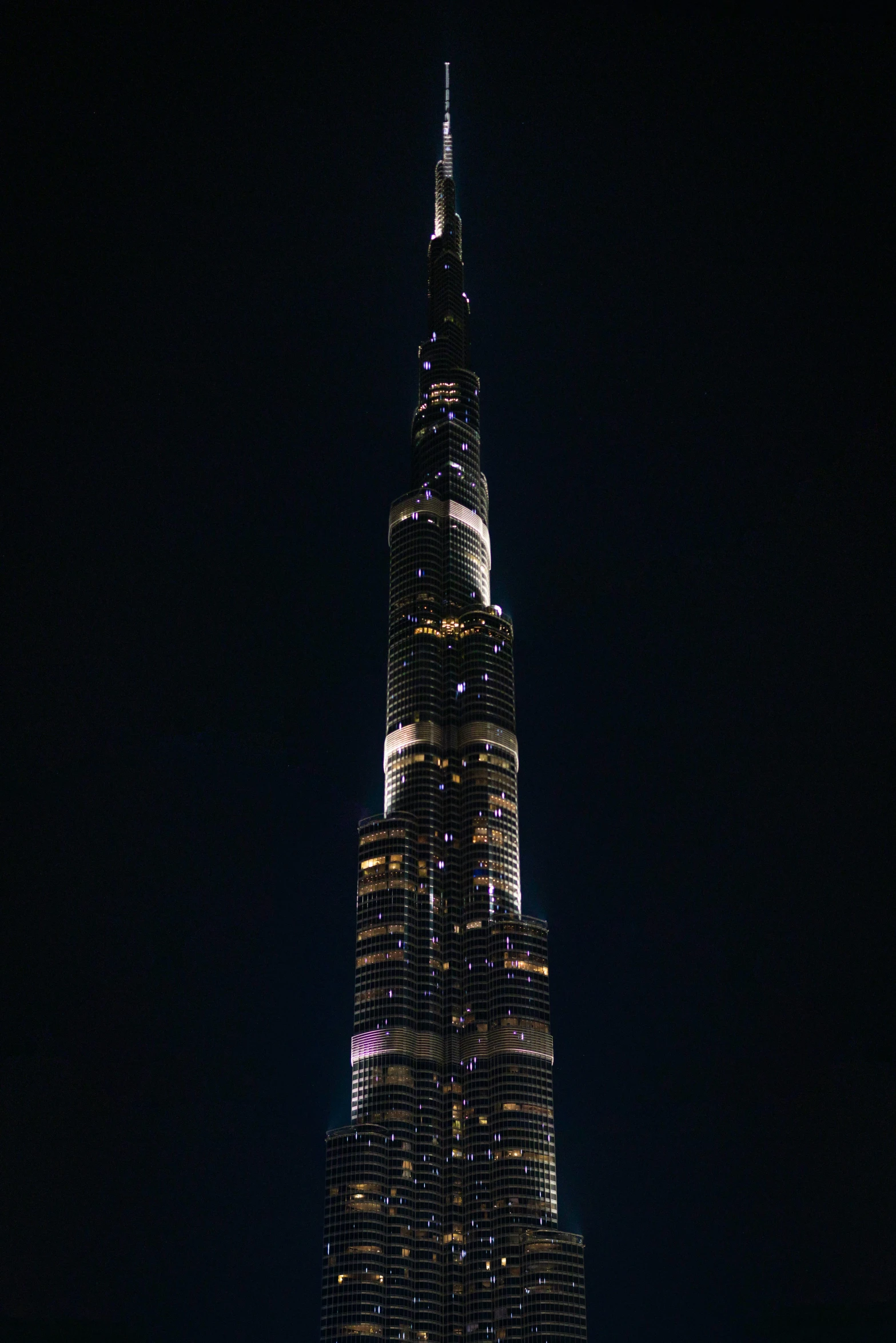 the burjra tower lit up at night, an album cover, 8k 50mm iso 10, towering high up over your view, aaaaaaaaaaaaaaaaaaaaaa, ✨🕌🌙