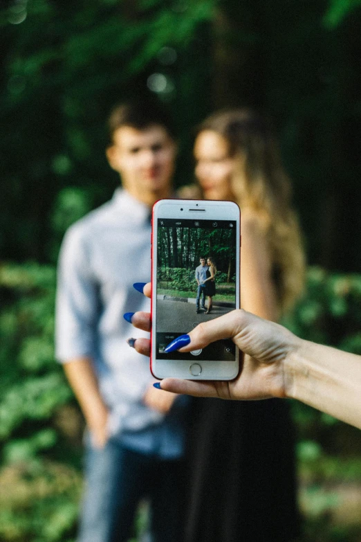 a person taking a picture with a cell phone, pexels, happening, couples portrait, 15081959 21121991 01012000 4k, in a medium full shot, love interest