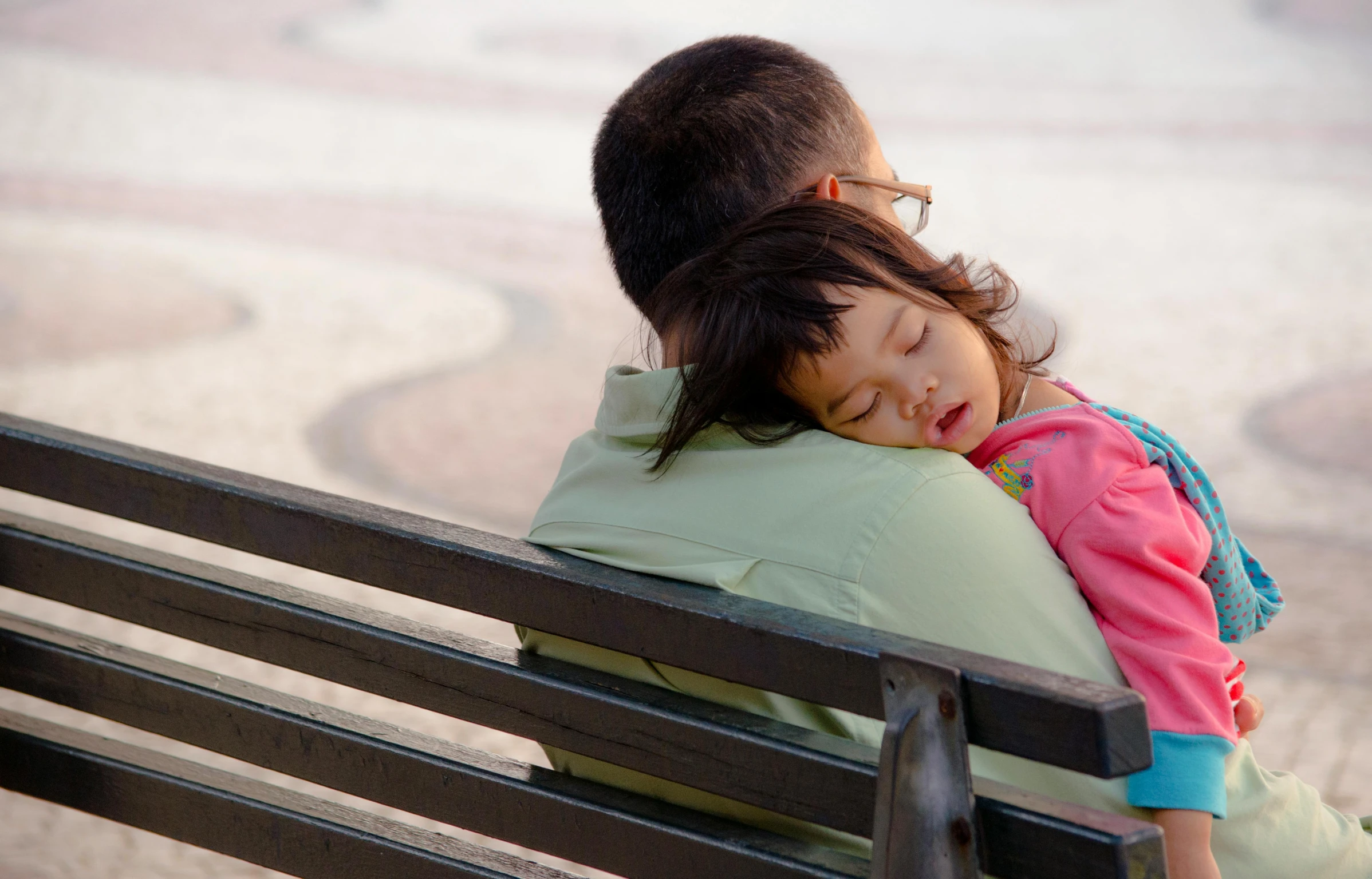 a man sitting next to a little girl on a bench, nearly napping, square, fatherly, romantic lead