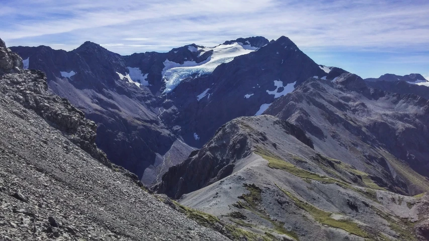 a group of people standing on top of a mountain, by James Ardern Grant, pexels contest winner, hurufiyya, glacier landscape, head down, profile image, high above treeline