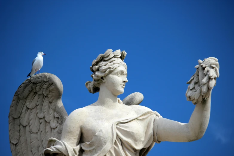 a statue with a bird perched on top of it, inspired by Antonio Canova, pexels contest winner, white and blue, avatar image, roma, with two pairs of wings