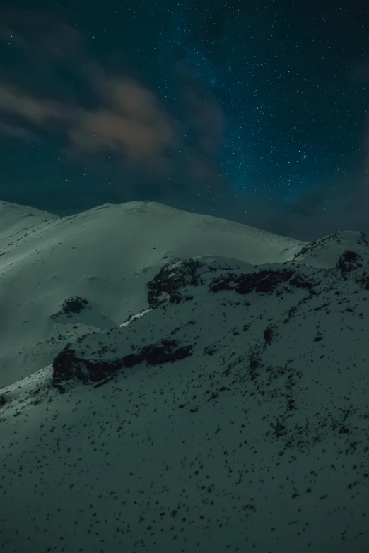 a person standing on top of a snow covered mountain, inspired by Michal Karcz, unsplash contest winner, mt elbrus at night, 4 k ”, 4k”