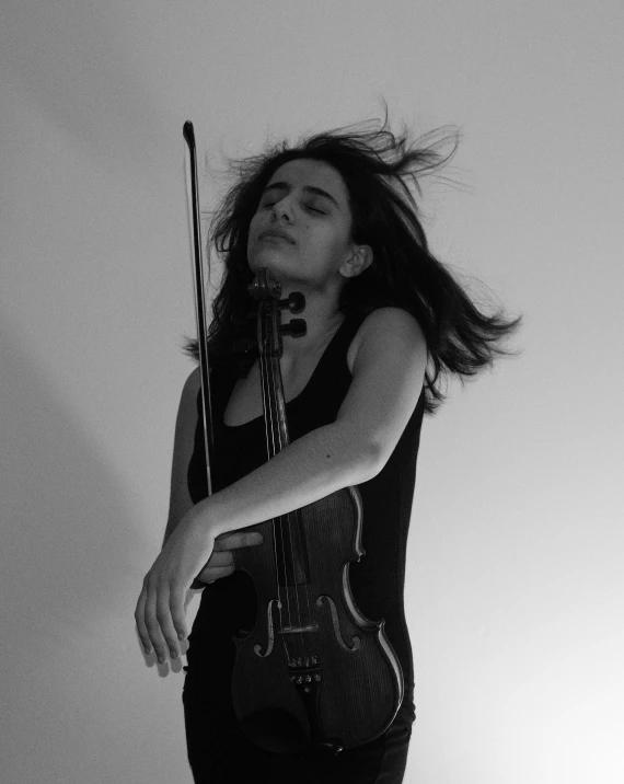 a black and white photo of a woman holding a violin, by Caro Niederer, antipodeans, sayem reza, hands in her hair, concerned, profile pic