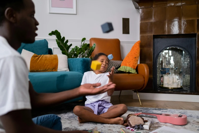 a man playing with a child in a living room, pexels contest winner, photo of a black woman, scattered props, promo image, no watermarks