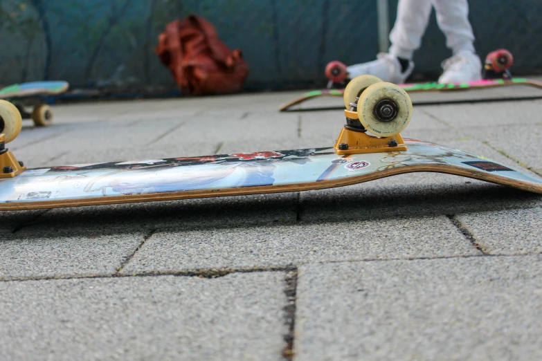 a close up of a skateboard on the ground, by Niko Henrichon, unsplash, hyperrealism, low quality footage, fan favorite, rollerskaters, low quality photo