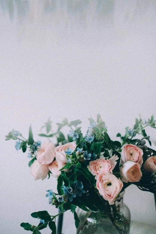 a couple of vases filled with flowers on top of a table, by Ryan Pancoast, trending on unsplash, romanticism, on a pale background, bouquet, blue, crown of peach roses