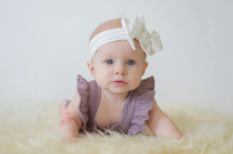 a baby girl wearing a purple dress and a white headband, pexels, albino, thick bow, instagram post, extremely high resolution