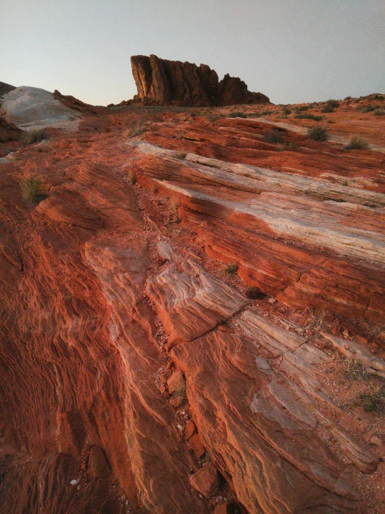 a rock formation in the middle of a desert, by Linda Sutton, unsplash contest winner, art nouveau, glowing red veins, ((rocks)), wide high angle view, slate