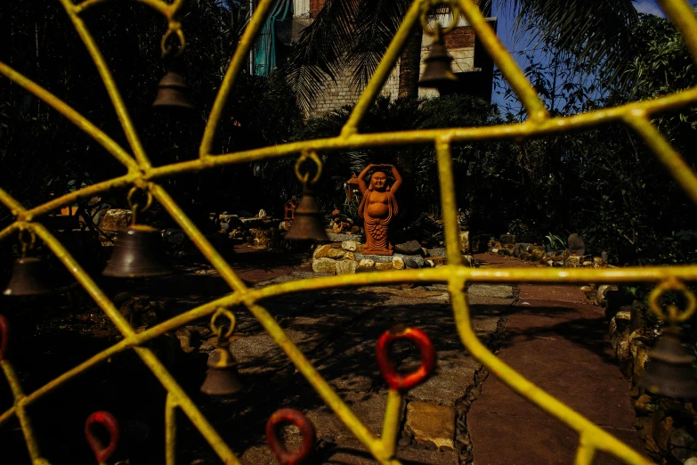 a clock tower behind a chain link fence, a portrait, unsplash, process art, standing in a hindu kovil, tlaquepaque, found objects, bells