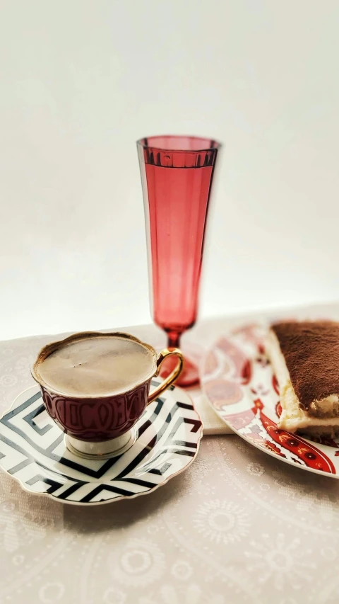 a table topped with plates of food and a cup of coffee, inspired by Jacopo Bellini, pexels, pop art, in crimson red, cocktail in an engraved glass, emma bridgewater and paperchase, champagne