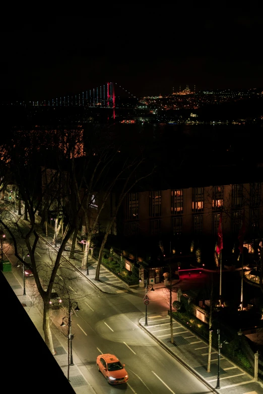 an aerial view of a city at night, by Nadim Karam, happening, tall terrace, istanbul, img _ 9 7 5. raw, red lights