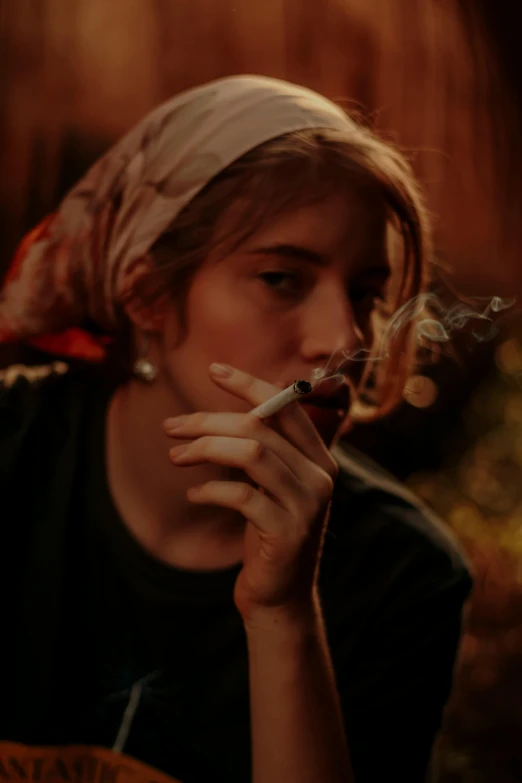 a person sitting at a table with a cigarette in their mouth, a portrait, inspired by Elsa Bleda, trending on pexels, renaissance, long night cap, teenage girl, ganja, profile image