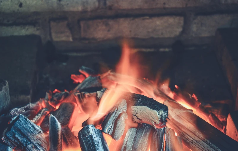 a pile of wood sitting on top of a fire, pexels contest winner, retro vibe, background image, fire from mouth, instagram post