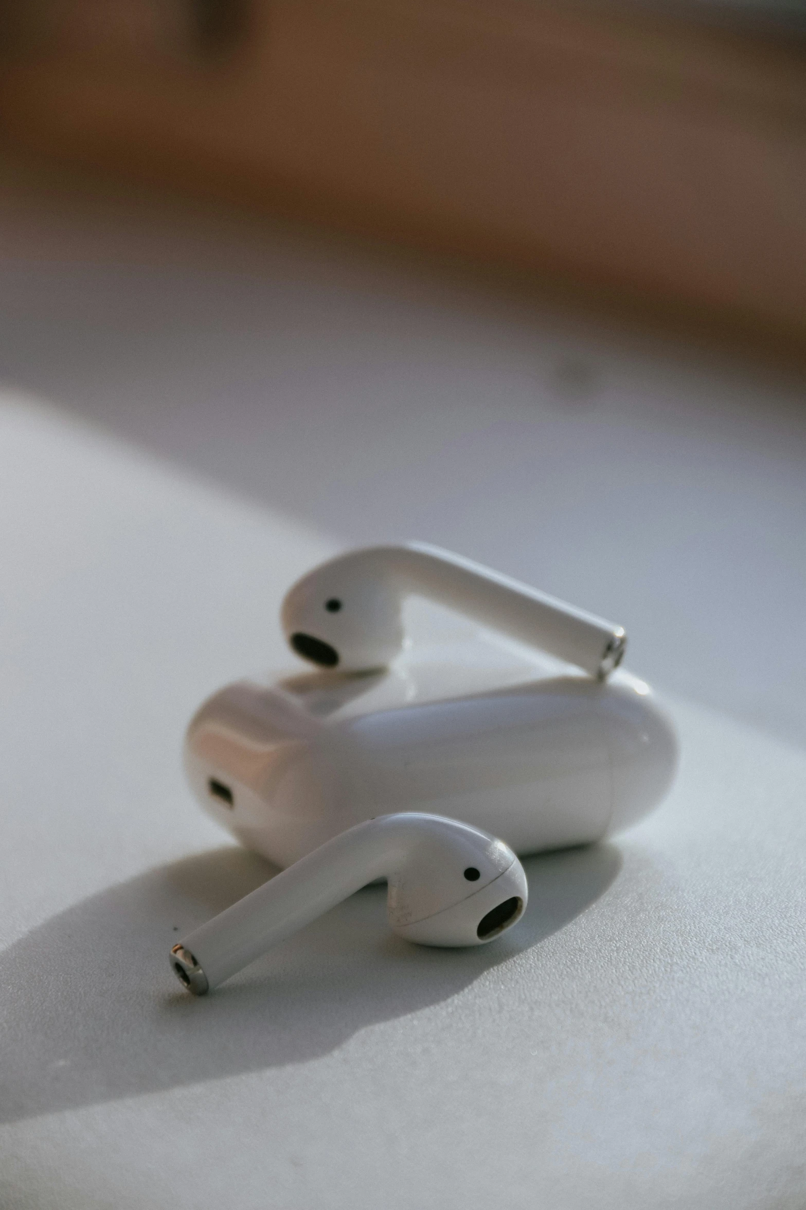 a pair of airpods sitting on top of a table, trending on pexels, close up. macro. hyper realistic, it has six thrusters in the back, 2010s, ap news photo